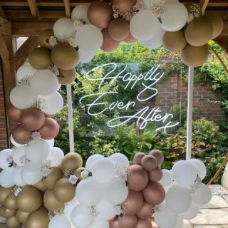The most beautiful setting at Three Choirs Vineyard, Wickham - for my beautiful Goddaughter Ellie & her lovely husband Matt’s special day 💕 The sun was shining! A wonderful occasion. A Bespoke Ceremony was written for them with a modern twist - such a honour to be part of their day 💗💕

Photographer: @samgavinsphotography 
Videographer : @weddingfilmguy
Flowers : @peonybluefloraldesign 
Cake: @suzyblakecakeatelier 
Band: @freight_train_runners
Singer: @tommillichamp 
Dress: @romseybridal 
Headdress: @whitedesignsbridal Designs bespoke bridal adornments
Suits: @cavendish_romsey 
Balloon Hoop: @balloonbeautyx 
Neon signs: @elizabethjamesevents 

#hampshirecelebrant #hampshireweddings #bespokeceremonies #yourdayyourway #happycouple #bride #groom #proudgodmother #familycelebrant #outdoorweddings #wedo #celebrantlove #weddings2021
#gettingmarried2022 #gettingmarried2023